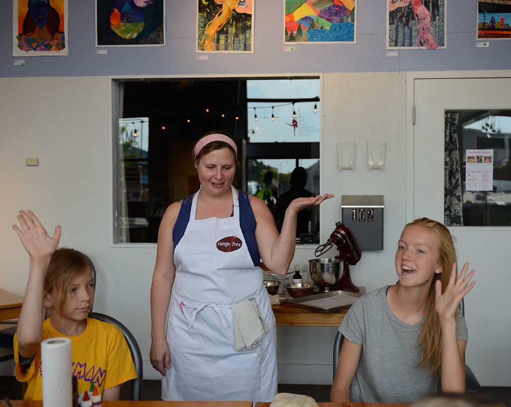 Anna Meyer, center, the owner of Range Free Cafe, teaches her annual cooking class for kids